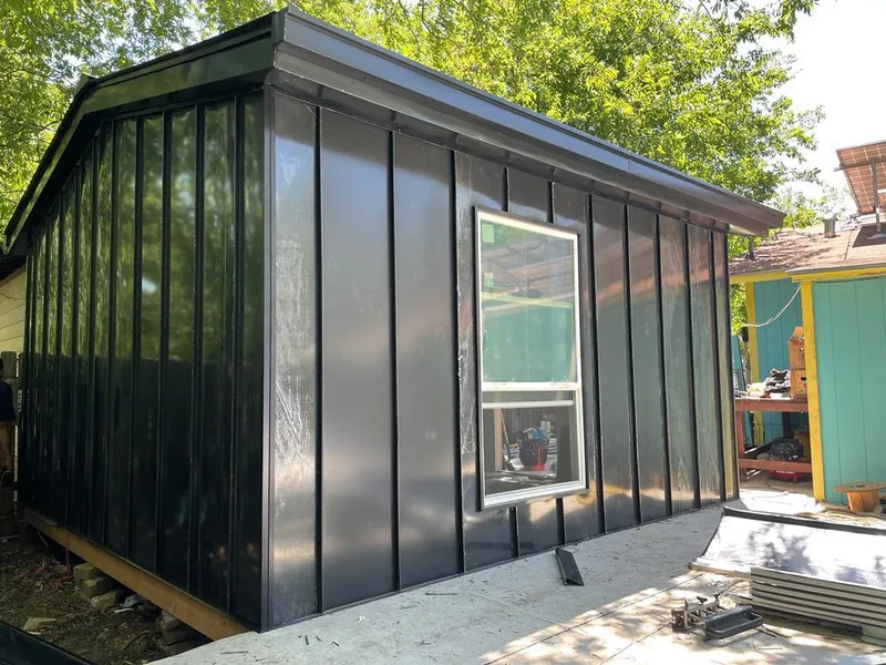 Black standing seam metal wall panels for Roof Inspection in Spring Grove