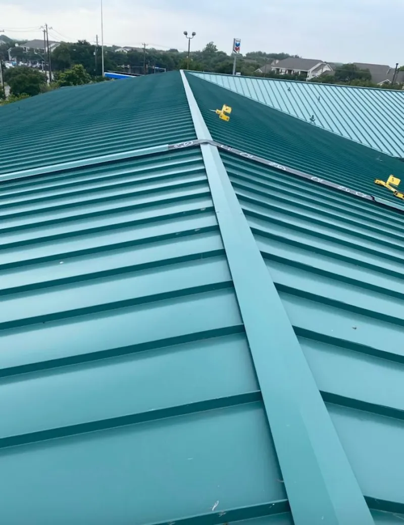 Green commercial metal roof ridge and valley for Metal Roof Repair in Spring Grove